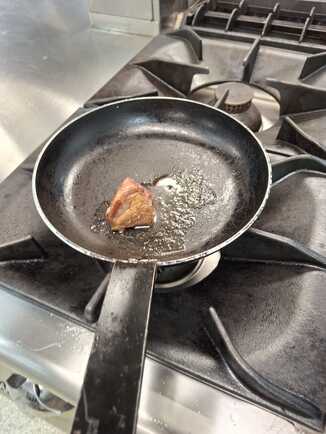 Frying the duck breast.