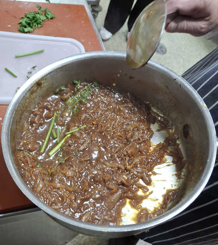 Infusing the soup with herbs.