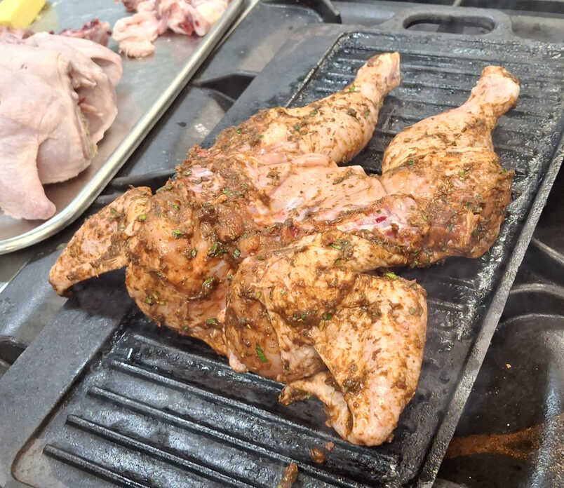 Spatchcocked Chicken. Greased and Grilling.