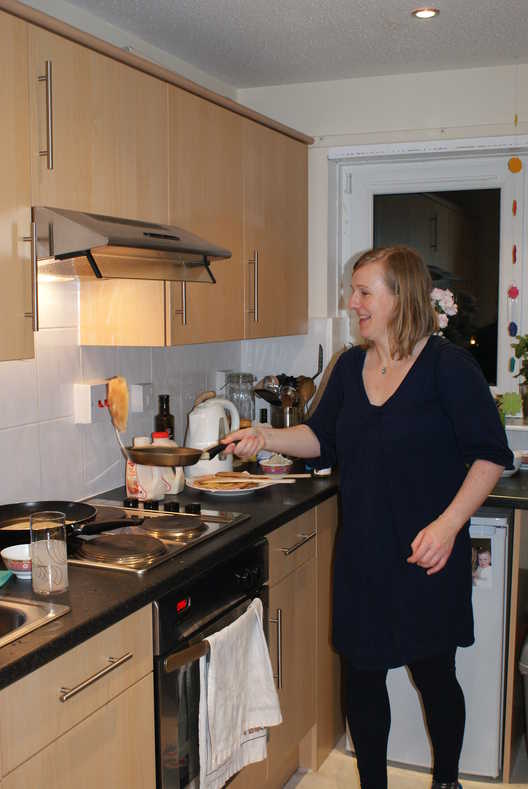 Annick flipping a pancake