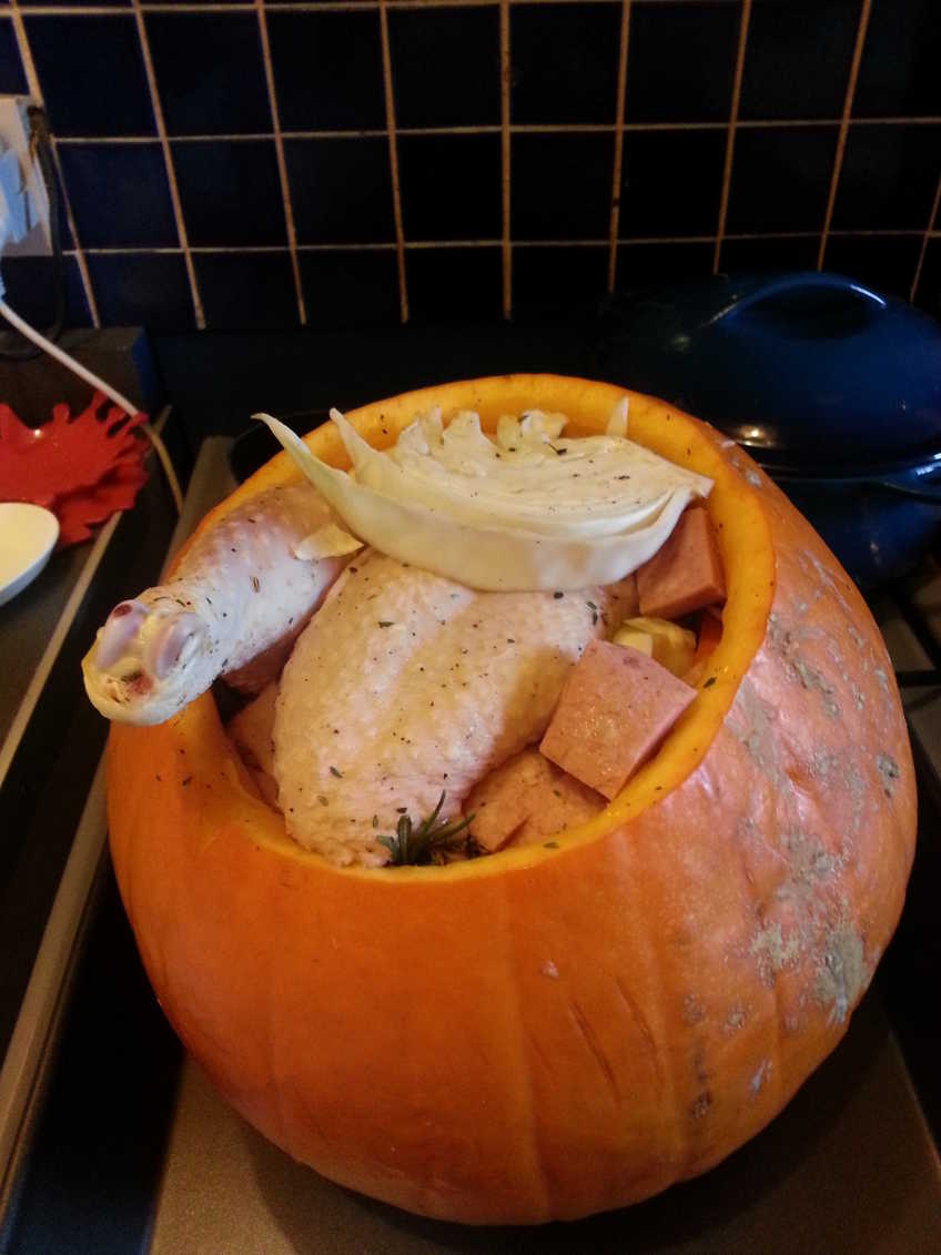 Uncooked chicken casserole in a pumpkin