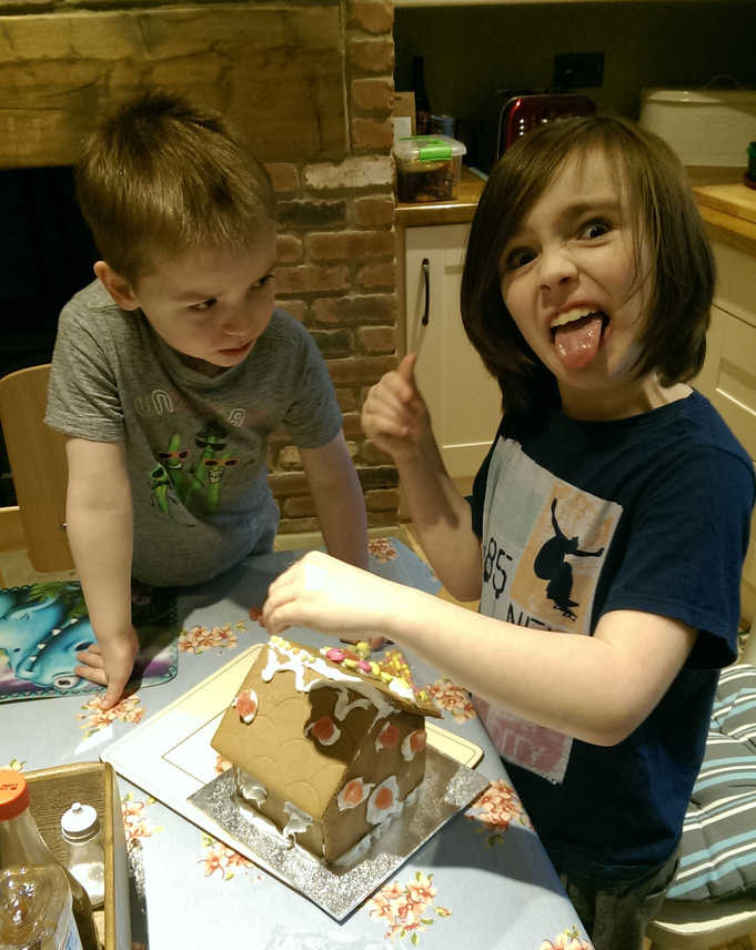 Kurts kids build a gingerbread house