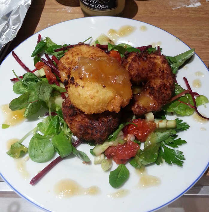 Coconut prawns on a mixed-leaf salad