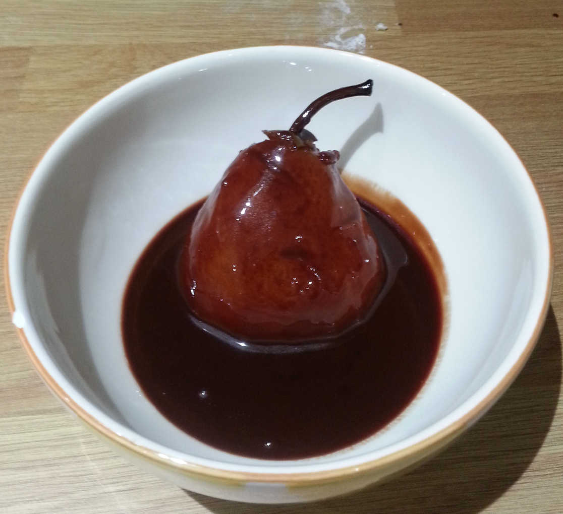 A pear poached in chocolate