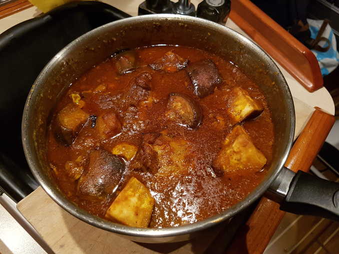 Chicken and potato base curry finished with tomatoes