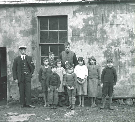 Children and their teacher outside the island one-room school.