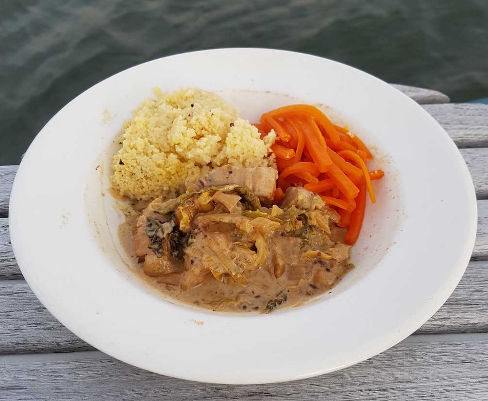 Belly Pork with Mustard, Cabbage and Cream. Served with Becherovka Carrots and Couscous