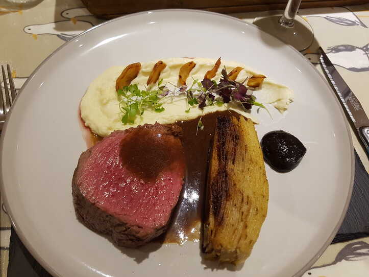 Parsnip Horseradish Purée with Parsnip Crisps,  Fillet Steak, Pommes Anna, and Black Garlic Gel.