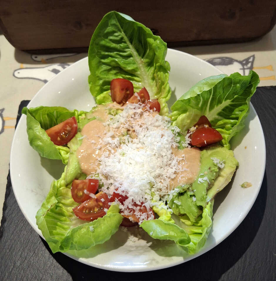 Miso Dressing and grated cheese on a salad