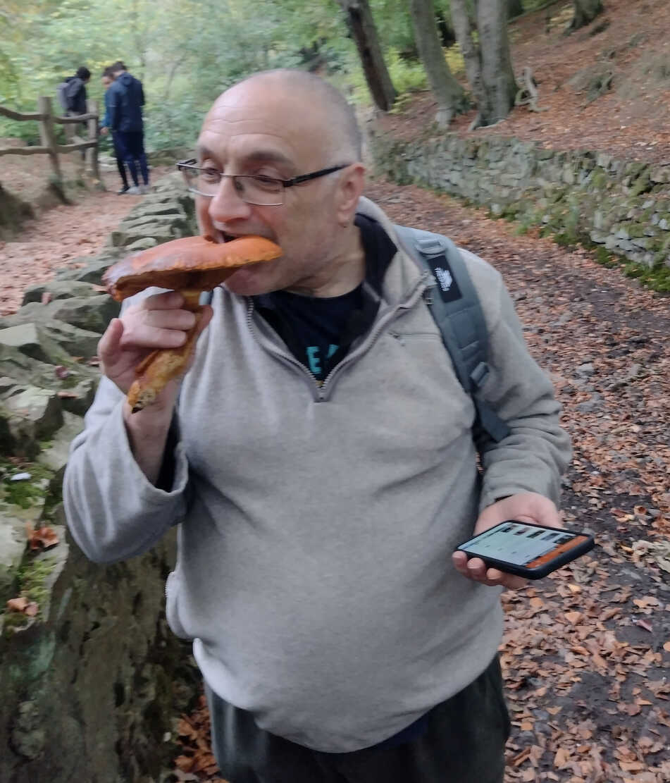 Karl pretending to eat a wild mushroom.
