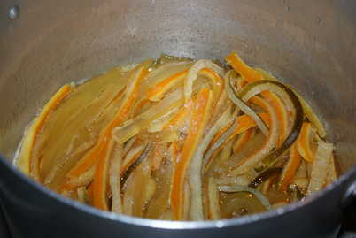 Peels simmering in syrup