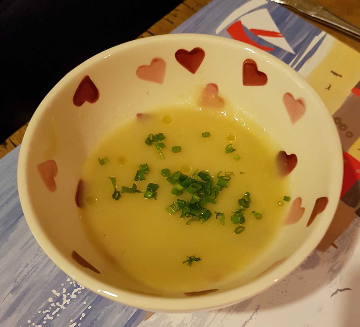 Jerusalem artichoke soup with chives and white truffle oil.